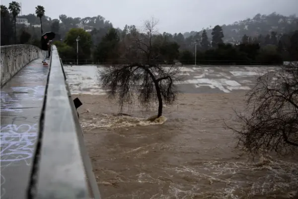 The swirling Los Angeles River on Monday.Credit...Jenna Schoenefeld for The New York Times